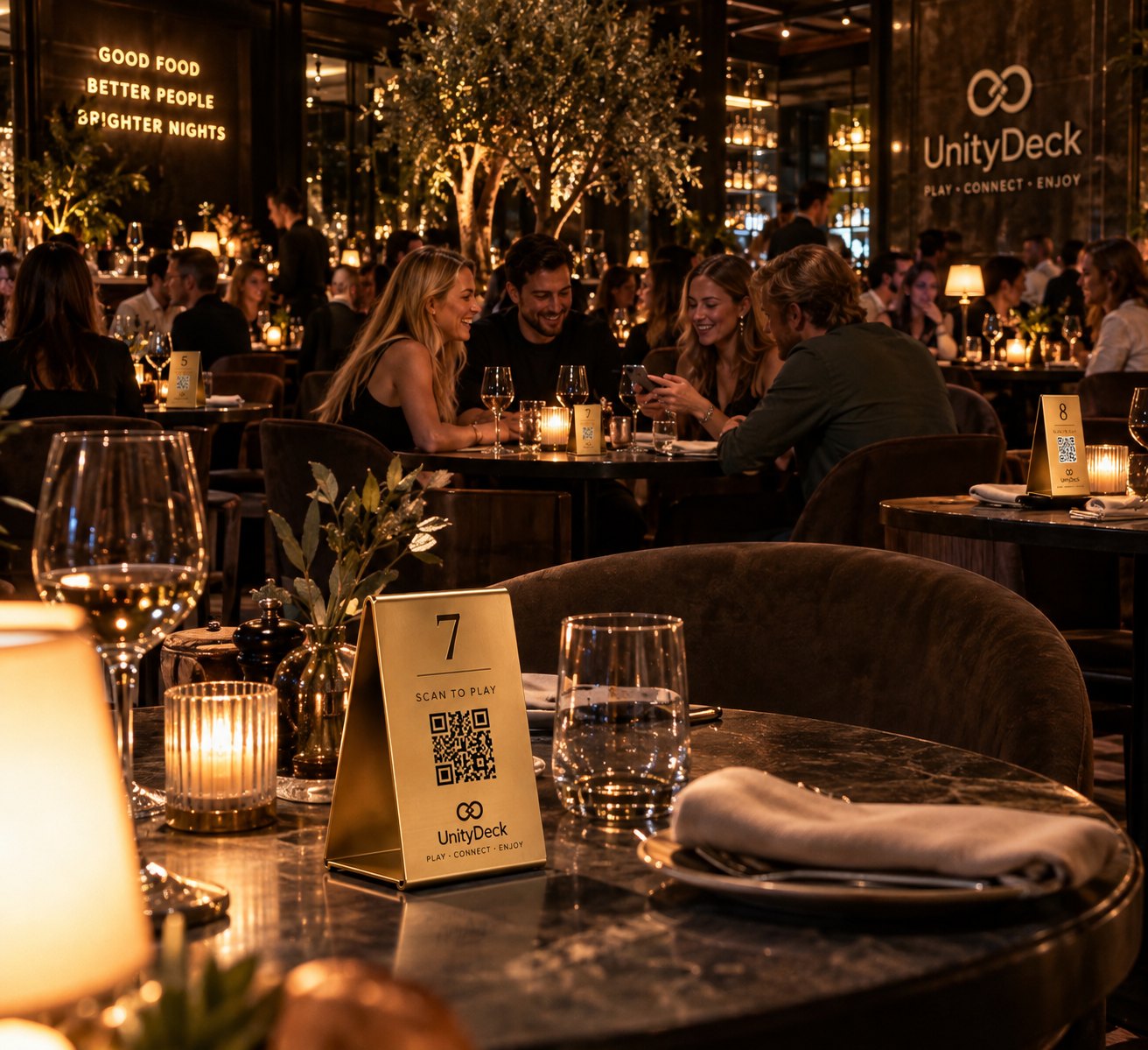 A table set for dinner with a UnityDeck table holder beside the candle, guests talking in the background